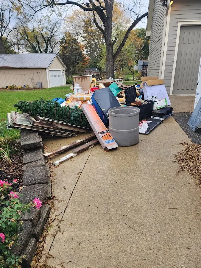 Dumpster being loaded with debris for Commercial Dumpster Rental in Abilene